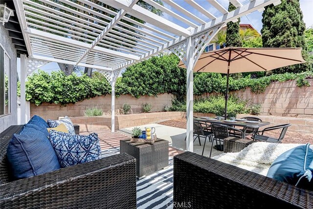 312 N Prospect Ave, Redondo Beach, CA 90277 - fenced backyard with an outdoor hangout area, outdoor dining area, a pergola, and a patio area