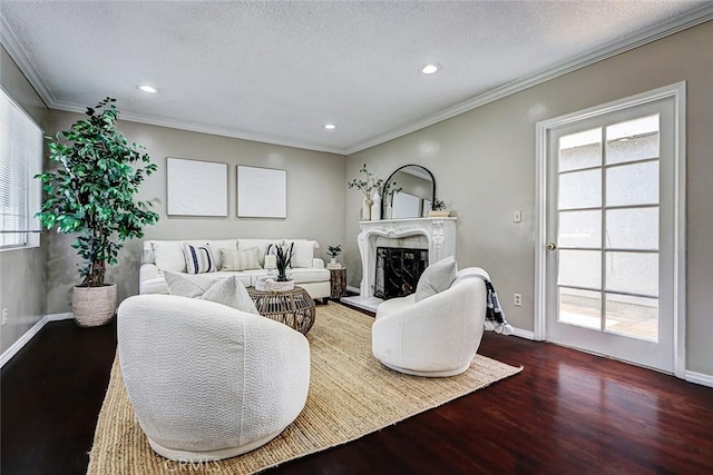 312 N Prospect Ave, Redondo Beach, CA 90277 - living area featuring wood finished floors, a fireplace with raised hearth, recessed lighting, baseboards, and ornamental molding