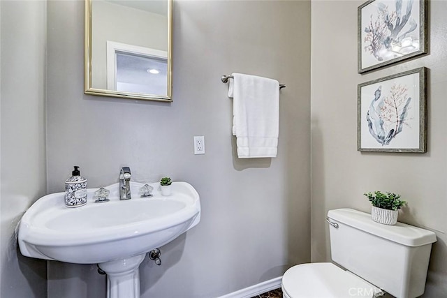 312 N Prospect Ave, Redondo Beach, CA 90277 - bathroom with toilet, a sink, and baseboards