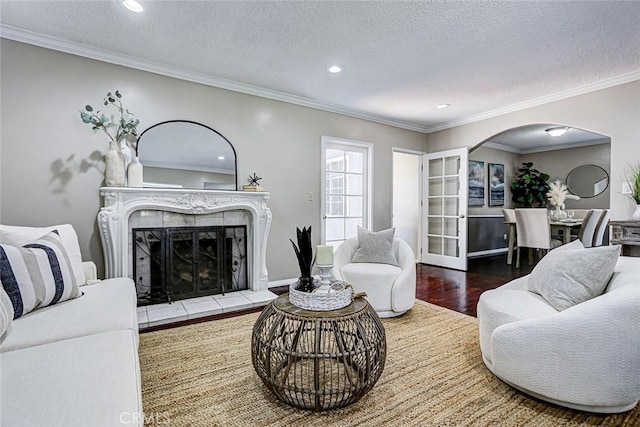 312 N Prospect Ave, Redondo Beach, CA 90277 - living room with arched walkways, wood finished floors, recessed lighting, a textured ceiling, and ornamental molding