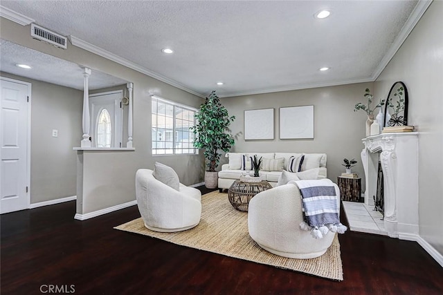 312 N Prospect Ave, Redondo Beach, CA 90277 - living room featuring wood finished floors, baseboards, recessed lighting, crown molding, and a fireplace with raised hearth