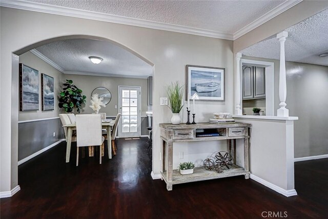 312 N Prospect Ave, Redondo Beach, CA 90277 - dining room featuring a textured ceiling, wood finished floors, arched walkways, baseboards, and ornamental molding