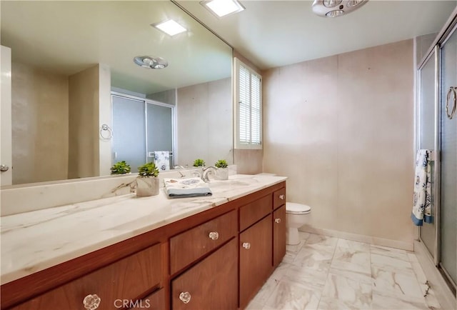 6604 Via Siena, Rancho Palos Verdes, CA 90275 - full bath with vanity, a shower stall, toilet, marble finish floors, and baseboards