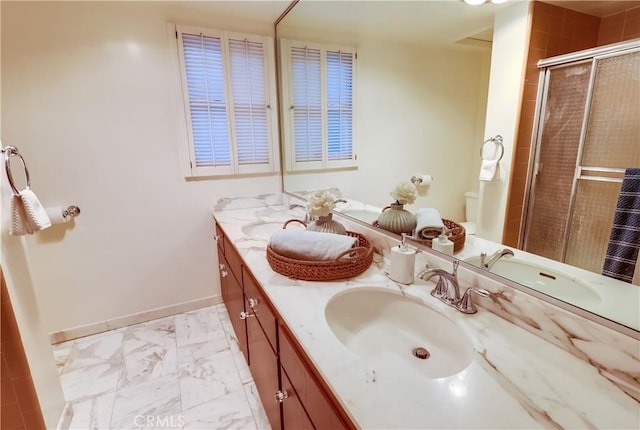 6604 Via Siena, Rancho Palos Verdes, CA 90275 - full bath with double vanity, marble look tiles, a shower stall, toilet, and baseboards