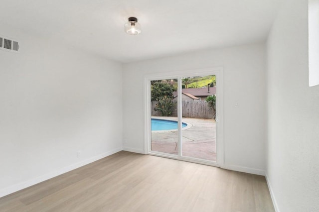 3243 Carolyn Cir, Oceanside, CA 92054 - spare room with light wood-style flooring and baseboards