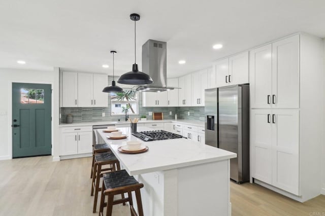 3243 Carolyn Cir, Oceanside, CA 92054 - kitchen featuring stainless steel appliances, light wood-style floors, healthy amount of natural light, decorative backsplash, and recessed lighting