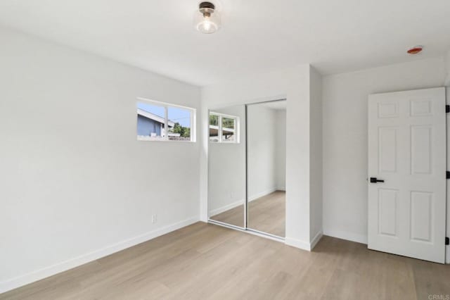 3243 Carolyn Cir, Oceanside, CA 92054 - unfurnished bedroom featuring light wood-style floors, a closet, and baseboards