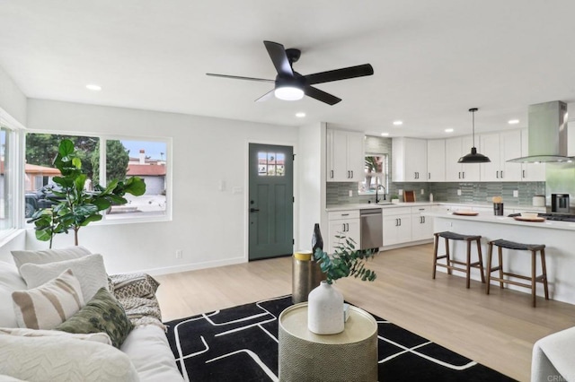 3243 Carolyn Cir, Oceanside, CA 92054 - living area with plenty of natural light, recessed lighting, ceiling fan, light wood-style floors, and baseboards