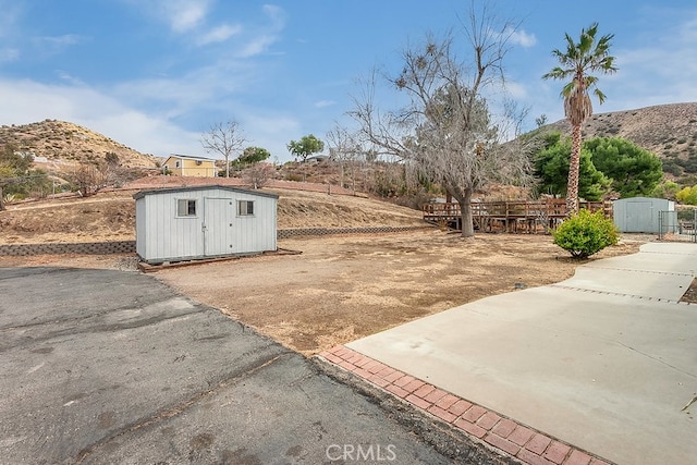 31346 Indian Oaks Rd, Acton, CA 93510 - view of yard featuring a storage unit and a mountain view