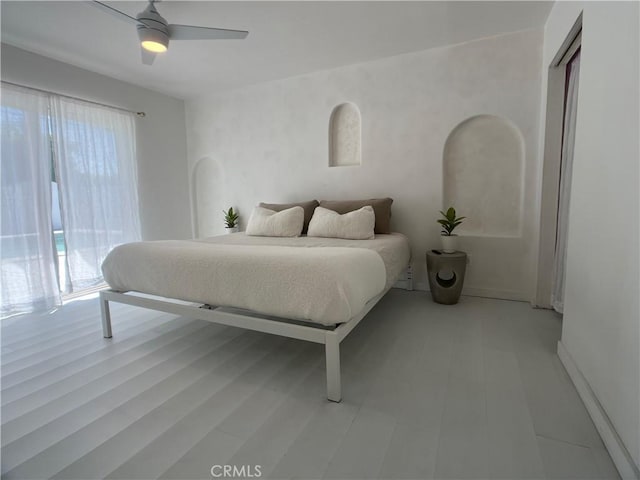 622 S Highland Dr, Palm Springs, CA 92264 - bedroom with multiple windows, a ceiling fan, baseboards, and light floors