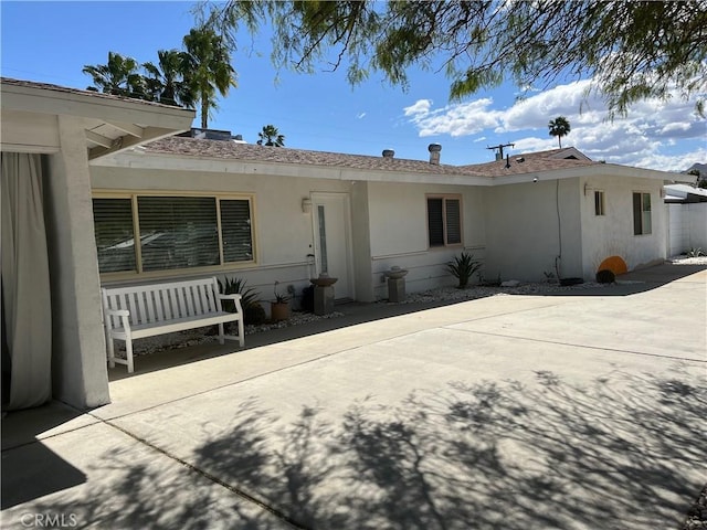 622 S Highland Dr, Palm Springs, CA 92264 - back of house featuring stucco siding and a patio