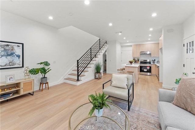436 E Truslow Ave, Fullerton, CA 92832 - living area with light wood-style floors, stairway, recessed lighting, and baseboards