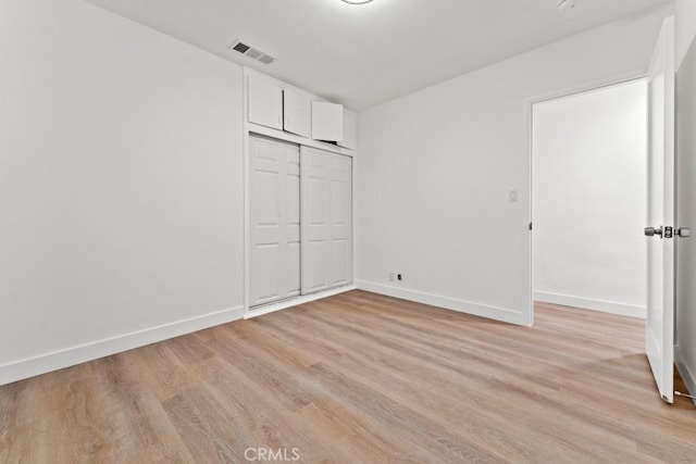 436 E Truslow Ave, Fullerton, CA 92832 - unfurnished bedroom featuring light wood-style floors, baseboards, and a closet