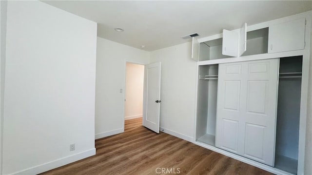 436 E Truslow Ave, Fullerton, CA 92832 - unfurnished bedroom with wood finished floors, a closet, and baseboards