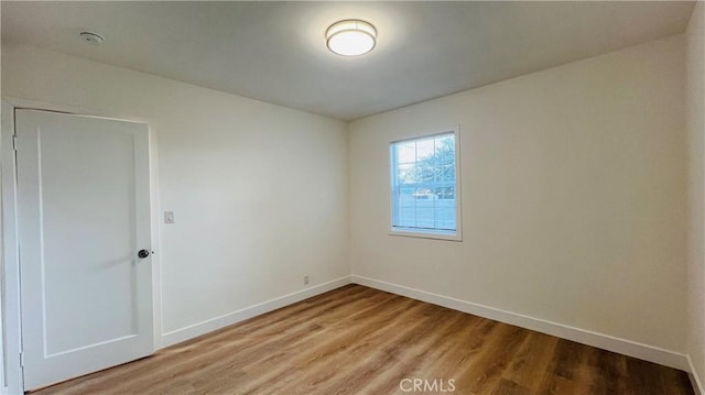 436 E Truslow Ave, Fullerton, CA 92832 - spare room with light wood-style flooring, baseboards, and a smoke detector