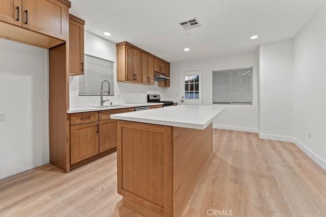 436 E Truslow Ave, Fullerton, CA 92832 - kitchen with a sink, gas range, light wood finished floors, light countertops, and recessed lighting