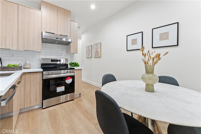436 E Truslow Ave, Fullerton, CA 92832 - kitchen with under cabinet range hood, electric range, light brown cabinetry, modern cabinets, and recessed lighting