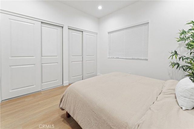 436 E Truslow Ave, Fullerton, CA 92832 - bedroom with light wood-style floors, two closets, and recessed lighting