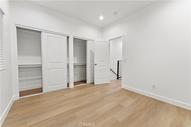 436 E Truslow Ave, Fullerton, CA 92832 - unfurnished bedroom featuring multiple closets, light wood-style floors, baseboards, and recessed lighting