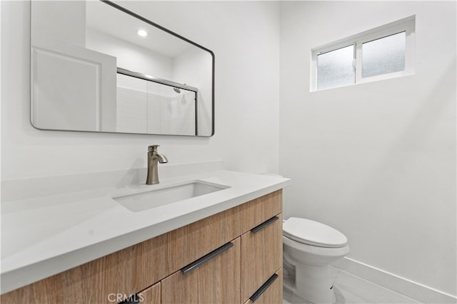 436 E Truslow Ave, Fullerton, CA 92832 - bathroom with vanity, toilet, baseboards, a shower with door, and recessed lighting