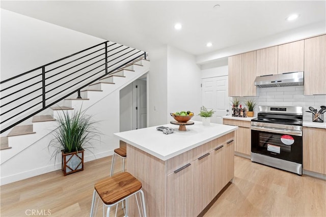 436 E Truslow Ave, Fullerton, CA 92832 - kitchen with stainless steel range with electric cooktop, light brown cabinetry, under cabinet range hood, modern cabinets, and recessed lighting