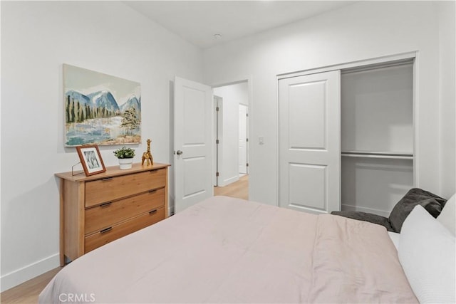 436 E Truslow Ave, Fullerton, CA 92832 - bedroom featuring baseboards, light wood-style flooring, and a closet