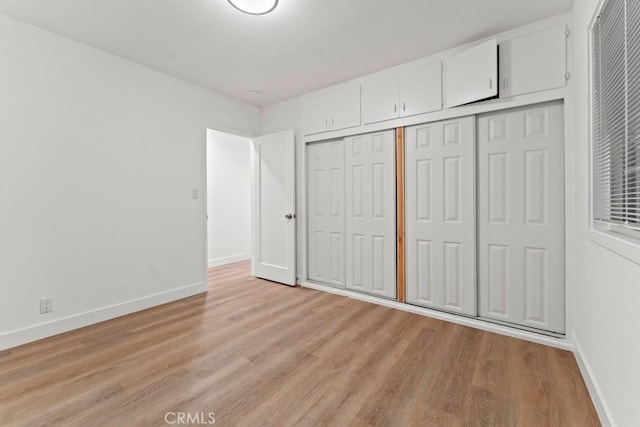 436 E Truslow Ave, Fullerton, CA 92832 - unfurnished bedroom with baseboards, light wood finished floors, and a closet