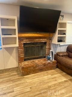 206 S Oak Glen Ave, Nipomo, CA 93444 - living area featuring a fireplace and wood finished floors