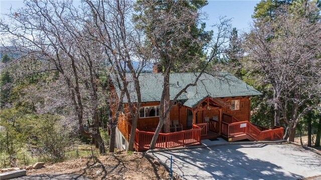 43897 Yosemite Dr, Big Bear Lake, CA 92315 - back of property featuring roof with shingles and a chimney