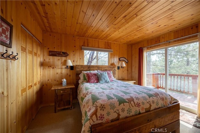 43897 Yosemite Dr, Big Bear Lake, CA 92315 - carpeted bedroom featuring access to outside, wooden walls, and wooden ceiling