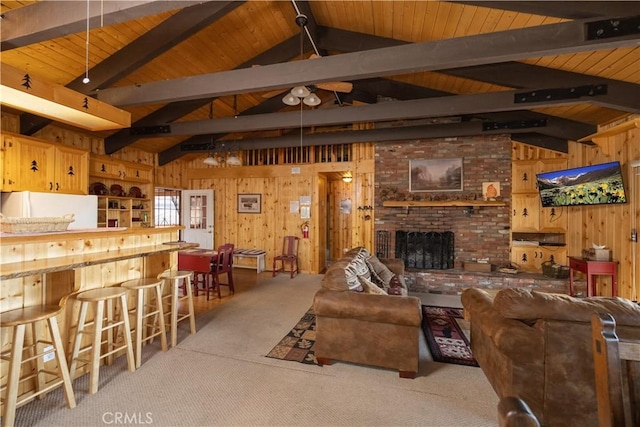 43897 Yosemite Dr, Big Bear Lake, CA 92315 - living room with wooden walls, wood ceiling, carpet flooring, and a brick fireplace