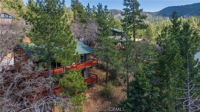 43897 Yosemite Dr, Big Bear Lake, CA 92315 - aerial view of property and surrounding area featuring a heavily wooded area and a mountain backdrop