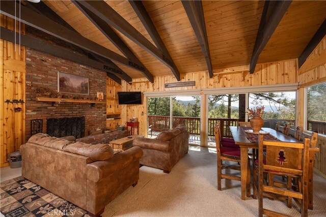 43897 Yosemite Dr, Big Bear Lake, CA 92315 - living area featuring wood ceiling, wooden walls, carpet floors, and a brick fireplace
