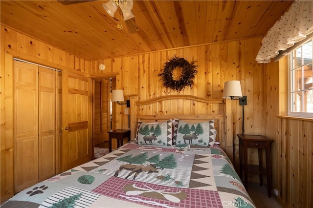43897 Yosemite Dr, Big Bear Lake, CA 92315 - bedroom featuring wood walls, wooden ceiling, carpet, and a closet