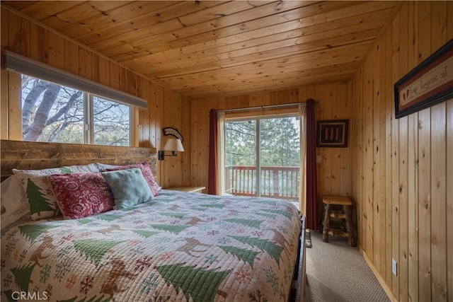 43897 Yosemite Dr, Big Bear Lake, CA 92315 - bedroom featuring multiple windows, carpet, access to outside, wood walls, and wooden ceiling