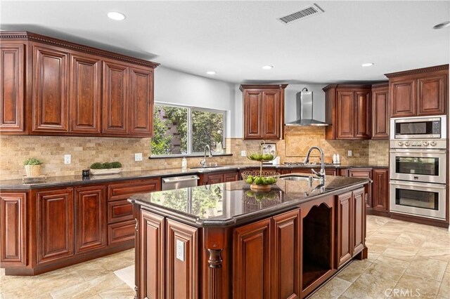 2421 N Feather Hill Dr, Orange, CA 92867 - kitchen featuring wall chimney exhaust hood, appliances with stainless steel finishes, recessed lighting, a sink, and decorative backsplash