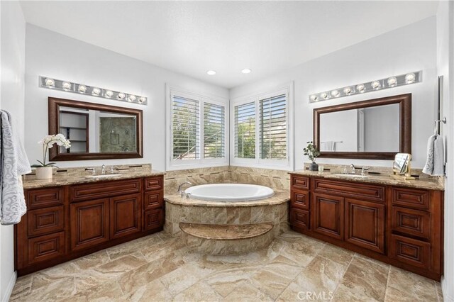 2421 N Feather Hill Dr, Orange, CA 92867 - full bath with two vanities, a garden tub, and recessed lighting