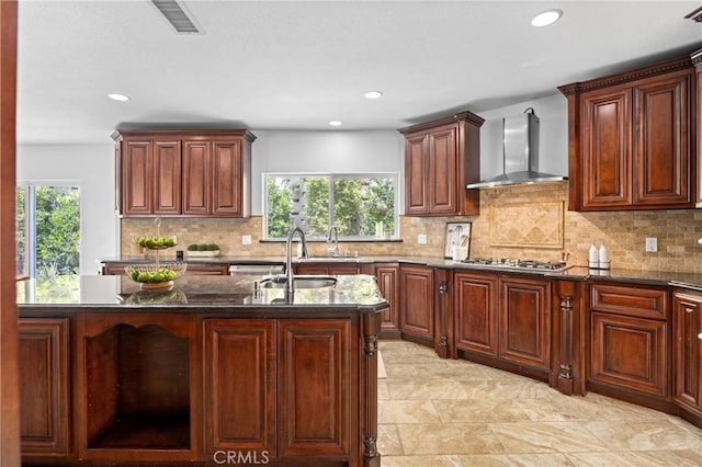 2421 N Feather Hill Dr, Orange, CA 92867 - kitchen with wall chimney exhaust hood, stainless steel gas cooktop, dark stone countertops, decorative backsplash, and recessed lighting