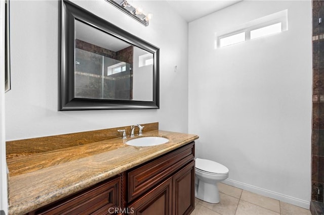 2421 N Feather Hill Dr, Orange, CA 92867 - bathroom with vanity, toilet, a tile shower, tile patterned flooring, and baseboards