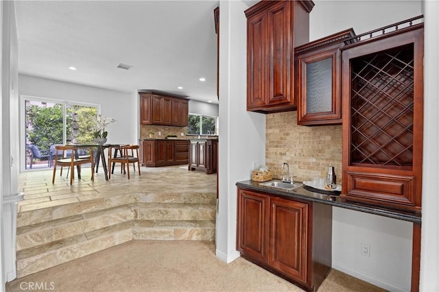 2421 N Feather Hill Dr, Orange, CA 92867 - indoor wet bar featuring healthy amount of natural light, tasteful backsplash, light carpet, recessed lighting, and baseboards
