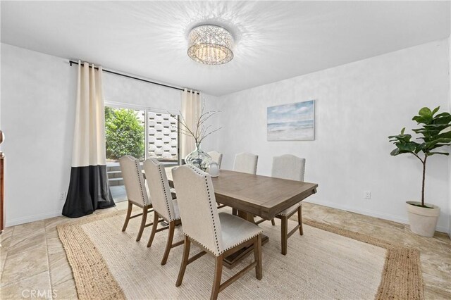 2421 N Feather Hill Dr, Orange, CA 92867 - dining space with a chandelier and baseboards