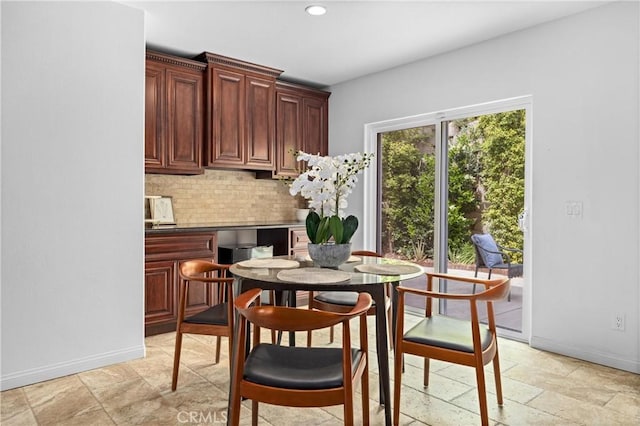 2421 N Feather Hill Dr, Orange, CA 92867 - dining space with baseboards, recessed lighting, and light stone finish flooring