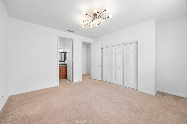 2421 N Feather Hill Dr, Orange, CA 92867 - unfurnished bedroom with light carpet, a chandelier, and baseboards
