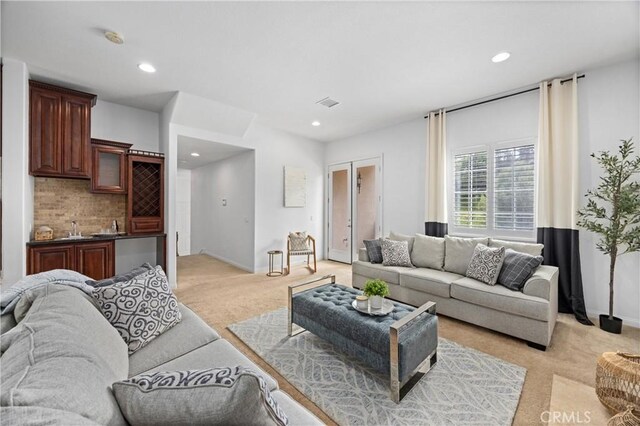 2421 N Feather Hill Dr, Orange, CA 92867 - living area featuring light carpet, recessed lighting, and baseboards