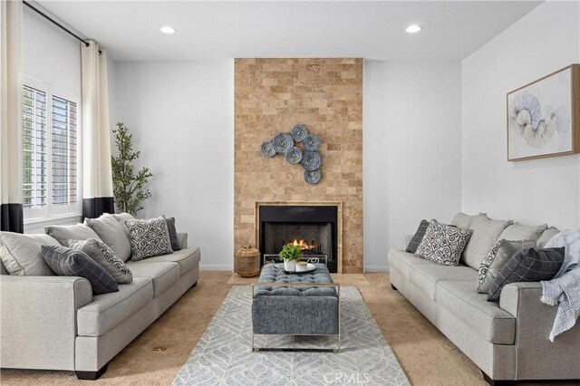 2421 N Feather Hill Dr, Orange, CA 92867 - living room with light carpet, recessed lighting, and a large fireplace