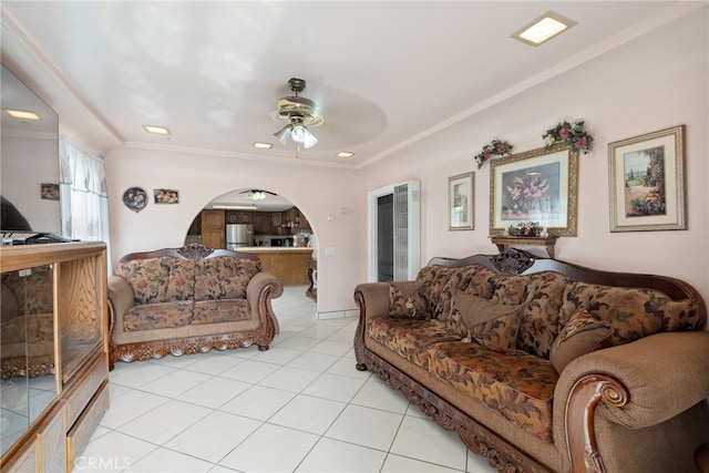 9637 San Carlos Ave, South Gate, CA 90280 - living room with light tile patterned flooring, arched walkways, ceiling fan, and ornamental molding