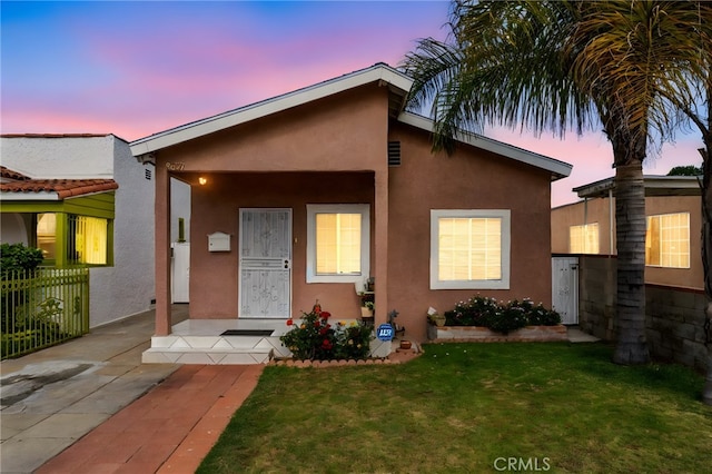 9637 San Carlos Ave, South Gate, CA 90280 - view of front facade with stucco siding and a front yard