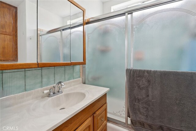 9637 San Carlos Ave, South Gate, CA 90280 - bathroom featuring vanity and an enclosed shower
