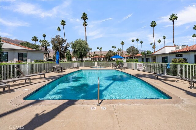 17 Toledo Dr, Rancho Mirage, CA 92270 - community pool with a patio area and a residential view