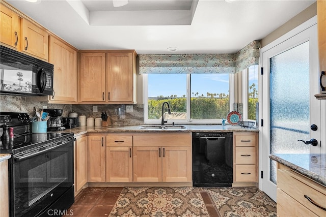 17 Toledo Dr, Rancho Mirage, CA 92270 - kitchen with black appliances, a sink, light brown cabinets, light stone countertops, and backsplash